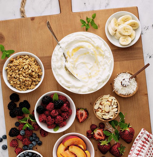 Yogurt bowl bar, big board with variety of toppings